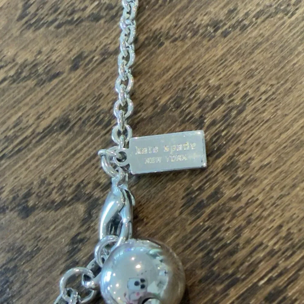 Kate Spade All Wrapped Up Silver Tone Ribbed Grosgrain Ribbon Bow Necklace Charm